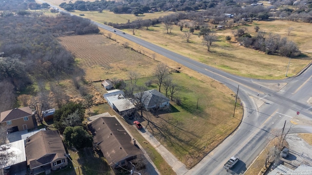 birds eye view of property with a rural view