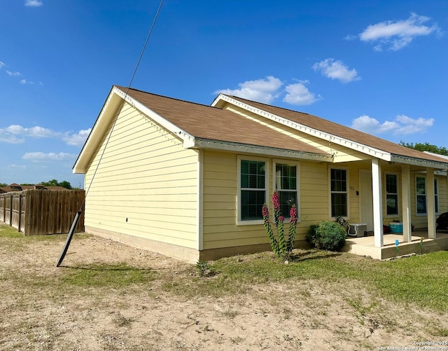 view of property exterior with a patio