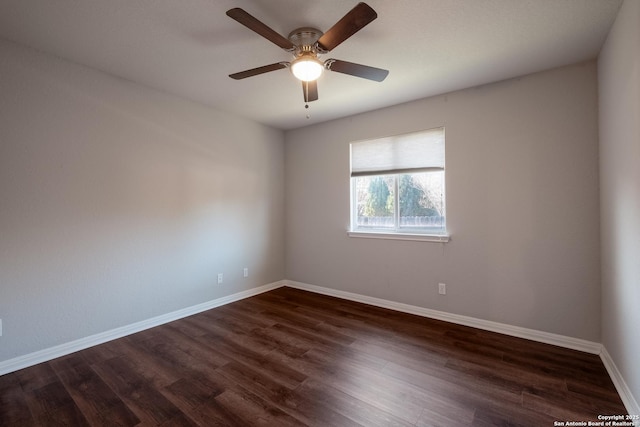 unfurnished room with ceiling fan and dark hardwood / wood-style flooring