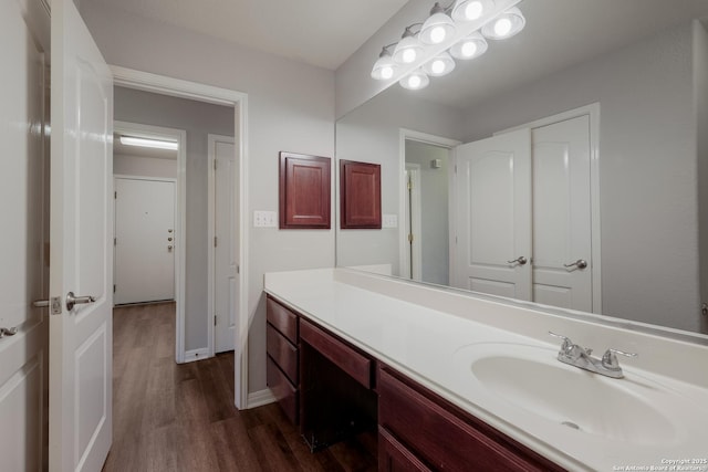 bathroom featuring vanity and hardwood / wood-style floors