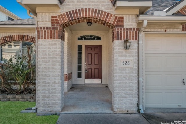 doorway to property featuring a garage