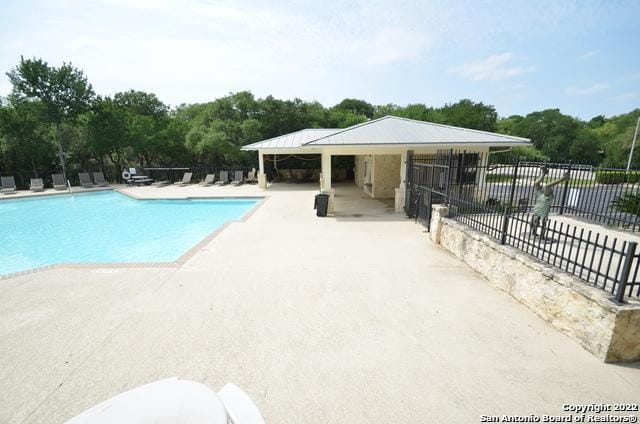 view of swimming pool featuring a patio