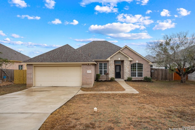 view of front of home with a garage and a front yard