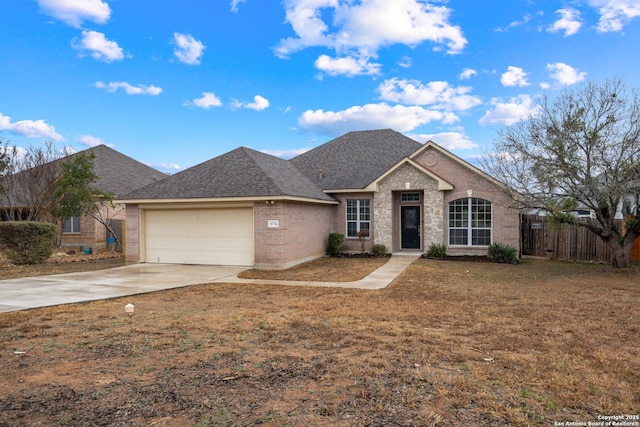 view of front of house with a garage and a front lawn