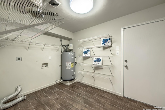 laundry room with hookup for a washing machine, gas dryer hookup, electric dryer hookup, and electric water heater