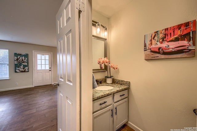 bathroom featuring vanity and wood-type flooring