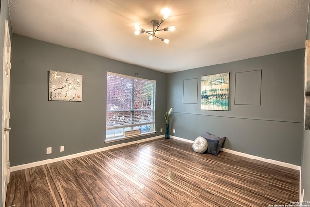 empty room featuring hardwood / wood-style flooring