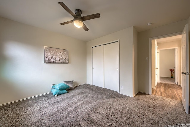 unfurnished bedroom featuring ceiling fan, carpet floors, and a closet