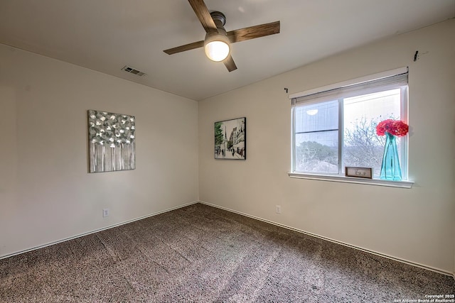 spare room featuring carpet floors and ceiling fan