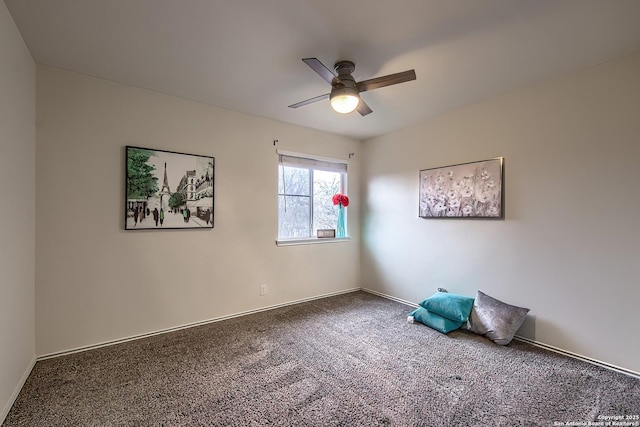 empty room featuring ceiling fan and carpet flooring