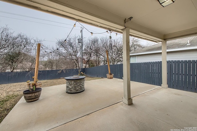 view of patio / terrace with an outdoor fire pit