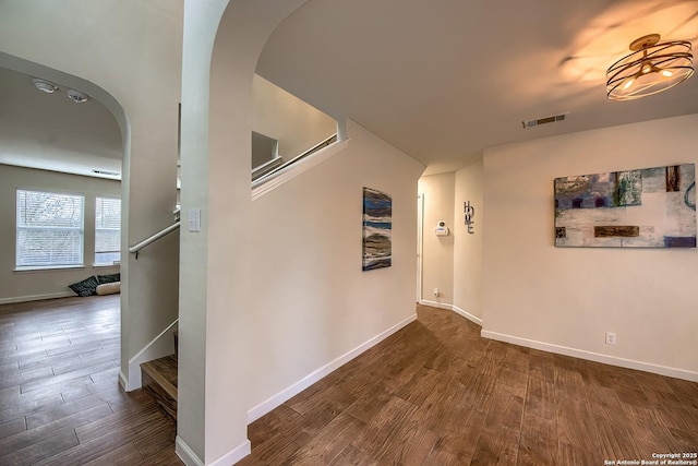 corridor featuring dark hardwood / wood-style flooring