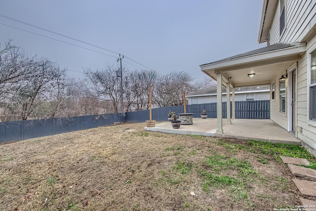 view of yard with an outdoor fire pit and a patio