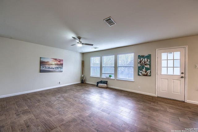 interior space with ceiling fan and dark hardwood / wood-style flooring