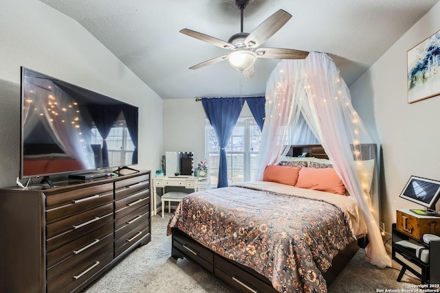 carpeted bedroom featuring lofted ceiling and ceiling fan