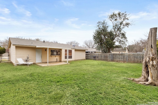 back of house featuring a yard and a patio area