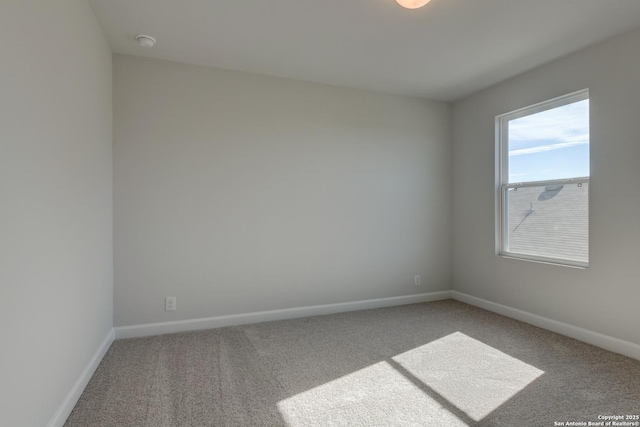 spare room featuring carpet floors