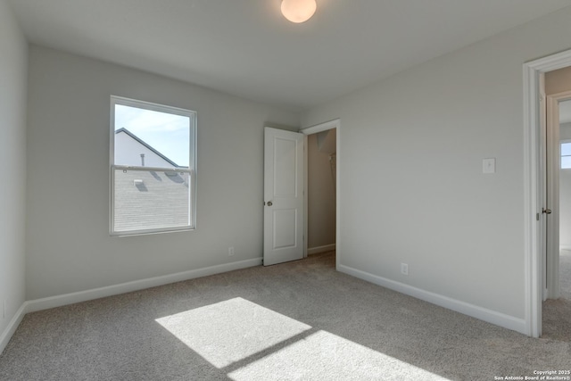 unfurnished bedroom with light carpet