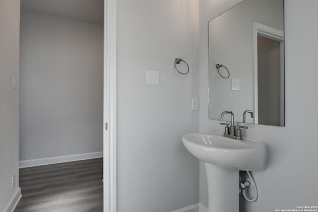 bathroom with sink and hardwood / wood-style floors