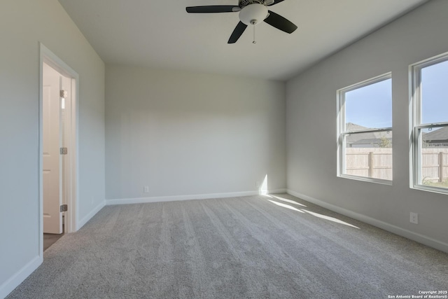 carpeted empty room with ceiling fan