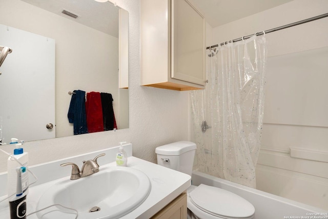 full bathroom featuring vanity, toilet, and shower / bathtub combination with curtain