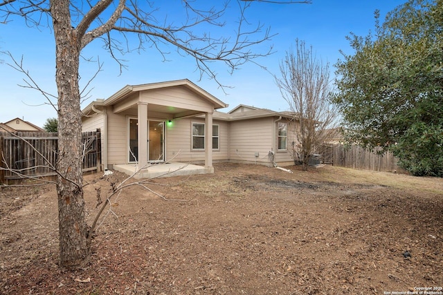 back of house with a patio