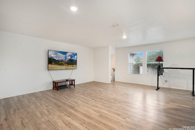 unfurnished living room with light wood-type flooring