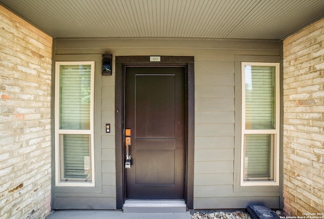 doorway to property featuring elevator