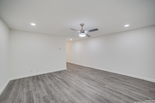 unfurnished room with wood-type flooring and ceiling fan