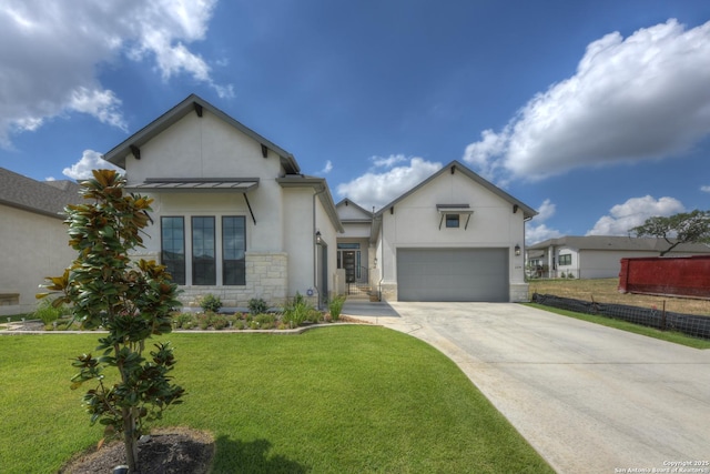 view of front of home featuring a garage and a front yard