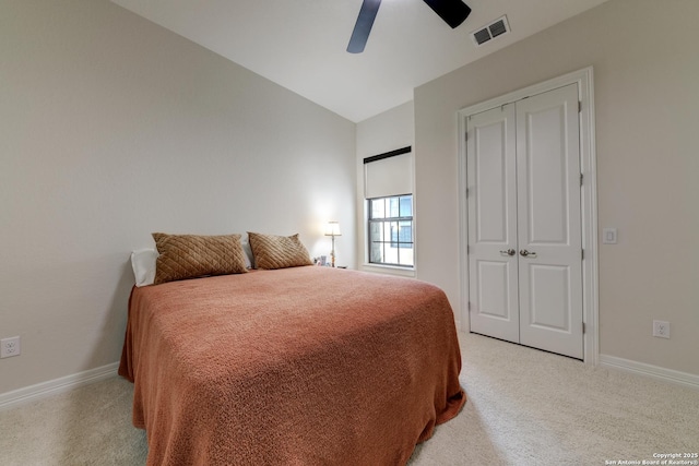 bedroom featuring ceiling fan, light colored carpet, and vaulted ceiling