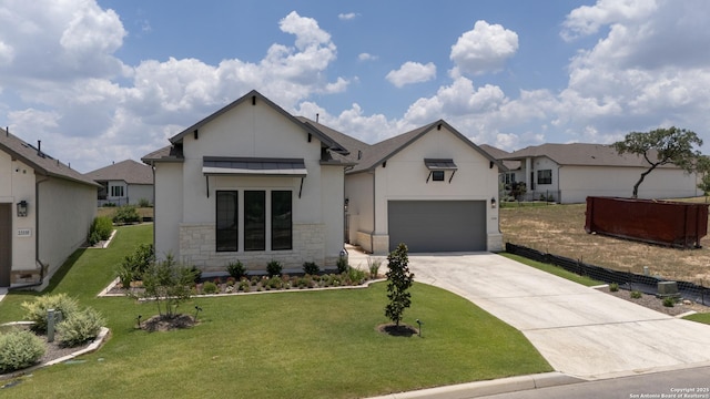 ranch-style house featuring a garage and a front lawn