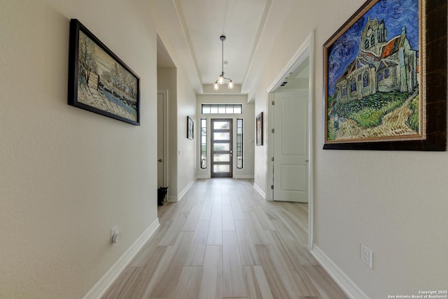 hallway with light hardwood / wood-style flooring