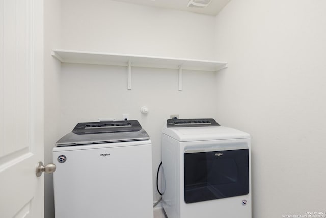 laundry area featuring separate washer and dryer