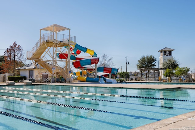 view of pool featuring a water slide