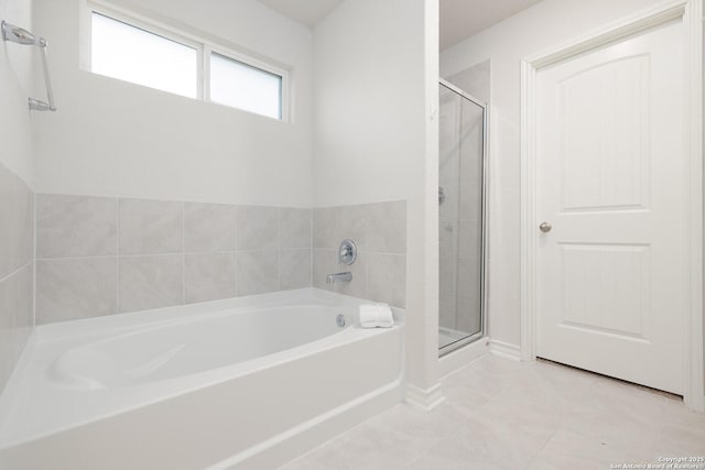 bathroom featuring separate shower and tub and tile patterned floors