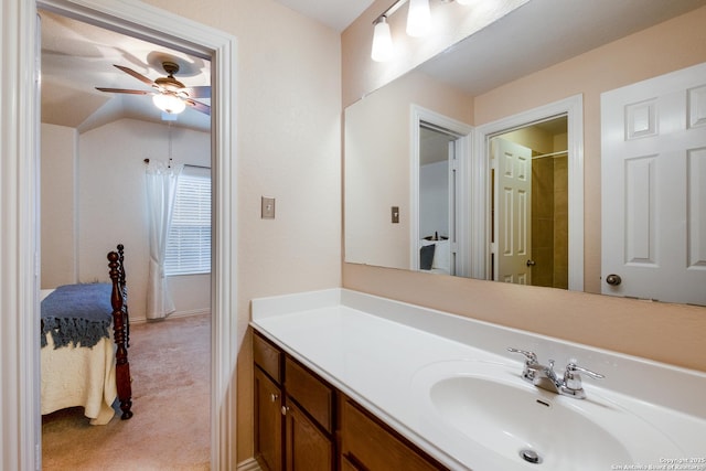 bathroom with vanity, lofted ceiling, and ceiling fan