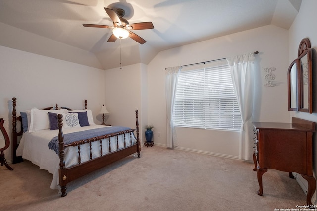 bedroom featuring vaulted ceiling, light colored carpet, and ceiling fan