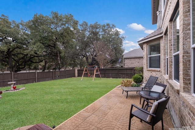 view of yard with a patio and a playground