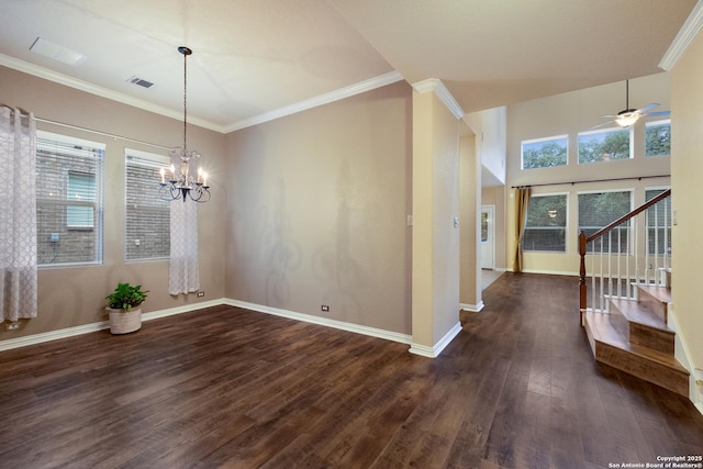 unfurnished dining area with ceiling fan with notable chandelier, ornamental molding, and dark hardwood / wood-style floors