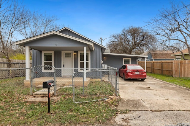 view of front of house featuring a carport and covered porch