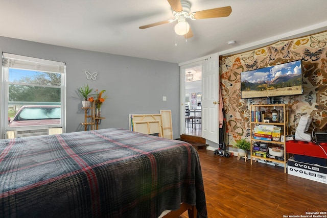 bedroom featuring ceiling fan and dark hardwood / wood-style floors