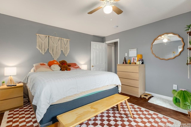 bedroom with dark wood-type flooring and ceiling fan