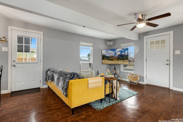 living room featuring dark wood-type flooring and ceiling fan