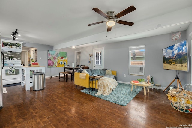 living room with dark hardwood / wood-style floors, cooling unit, and ceiling fan