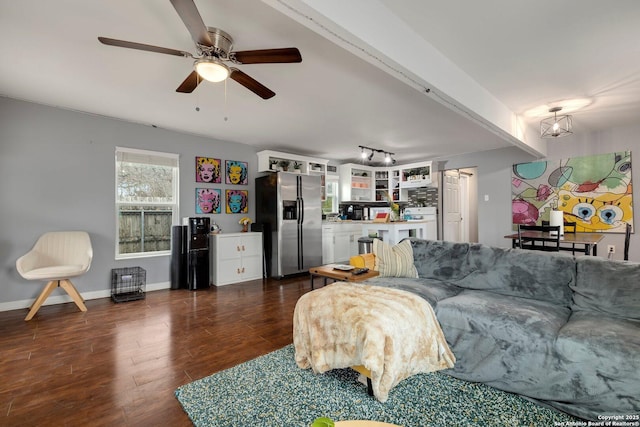 living room featuring dark wood-type flooring, ceiling fan, and track lighting