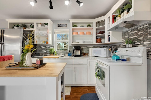 kitchen featuring white appliances, dark wood-type flooring, wooden counters, ventilation hood, and white cabinets