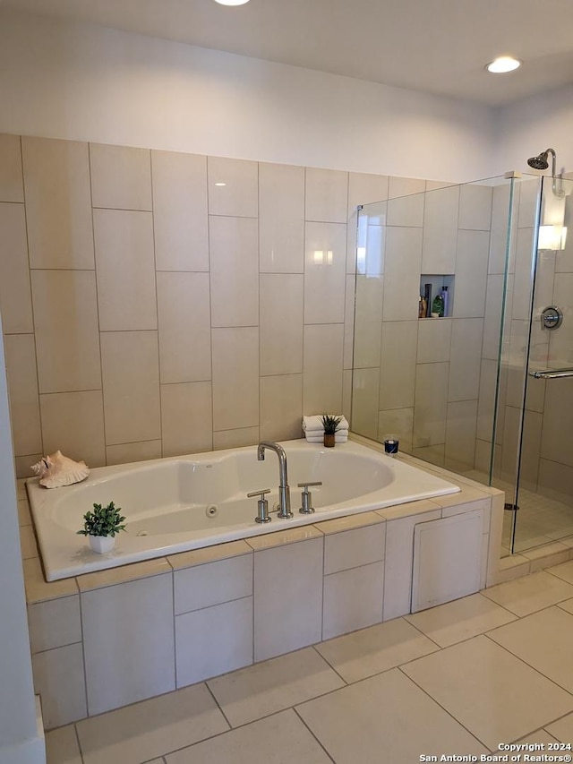 bathroom featuring independent shower and bath and tile patterned floors