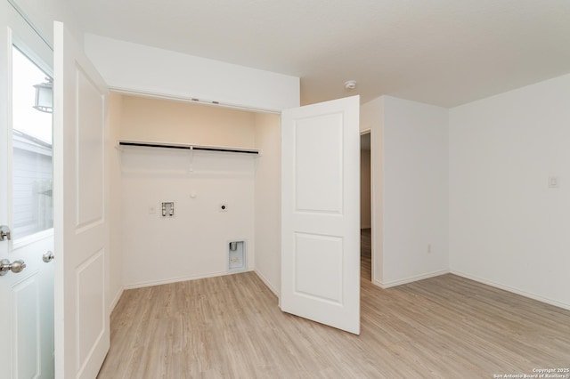 washroom with hookup for a gas dryer, hookup for a washing machine, light hardwood / wood-style floors, and hookup for an electric dryer