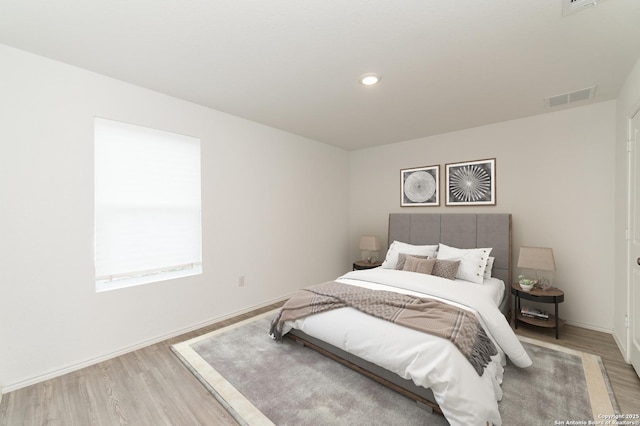 bedroom with wood-type flooring